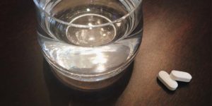 Glass of water and some panafdol