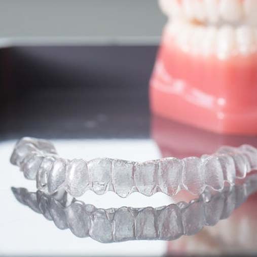 A picture of an Invisalign clear retainer