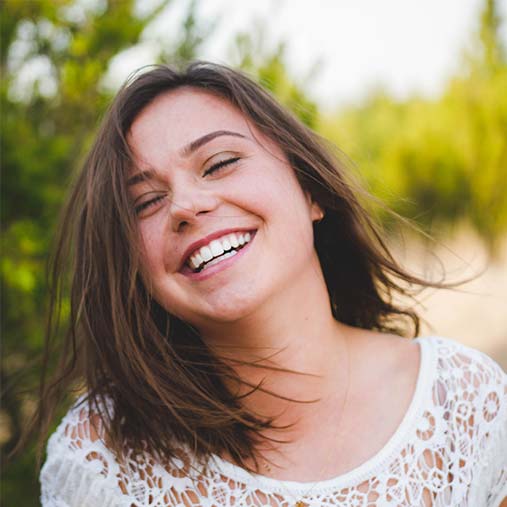Girl smiling in the outdoors