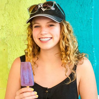 Metal braces A teenage girl smiling with braces